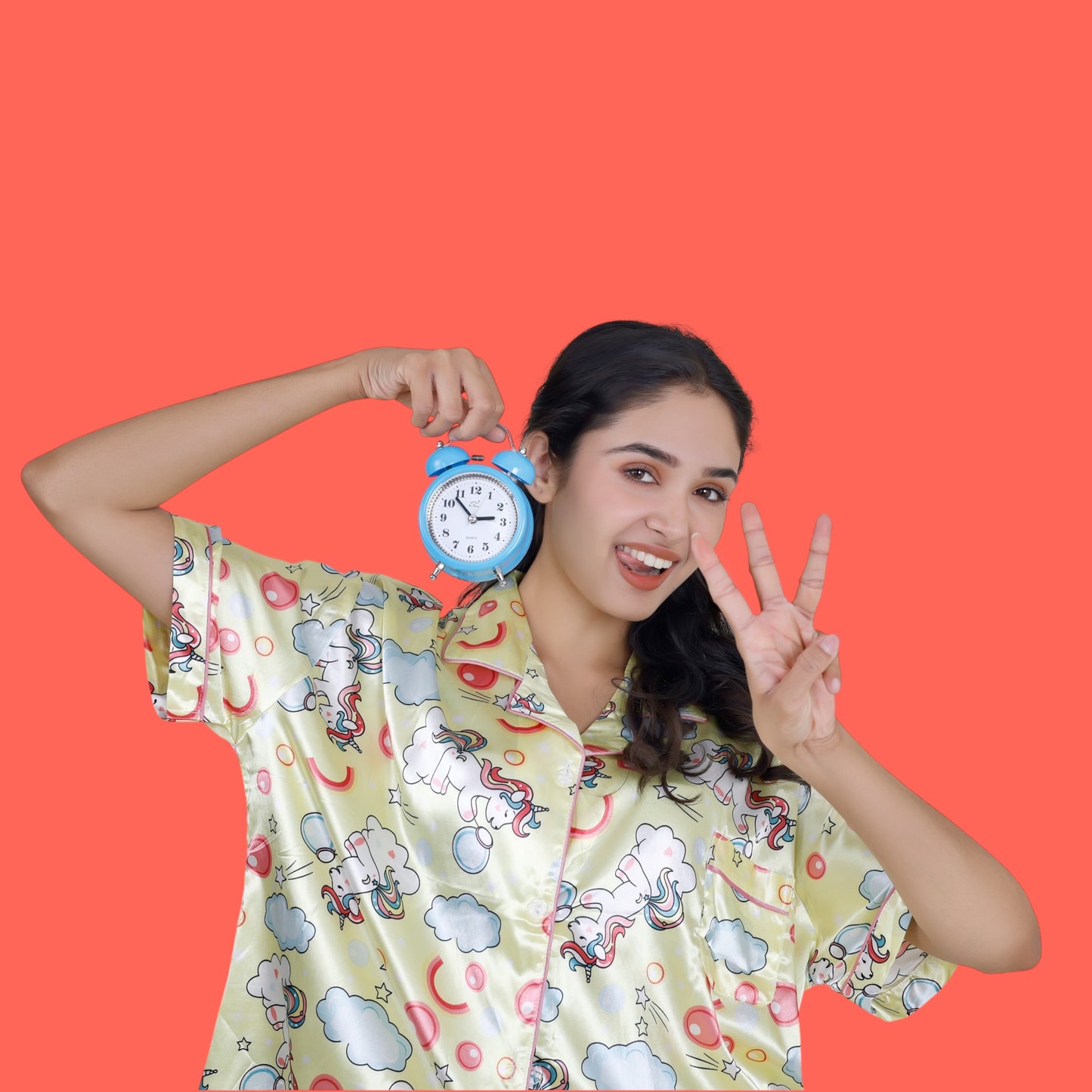 Woman wearing pastel yellow satin unicorn shorts set with black piping, whimsical luxury loungewear by WakeUp Chicq.
