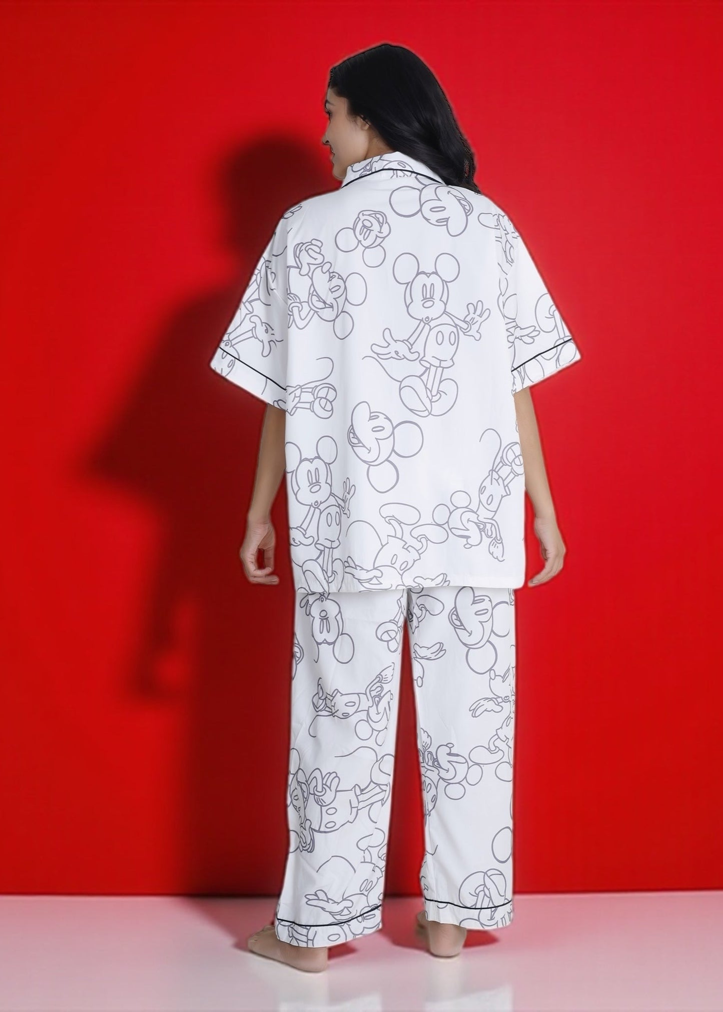 White crepe pyjama set with oversized Mickey Mouse print. Soft, relaxed, and luxe loungewear by WakeUp Chicq for Disney lovers.
