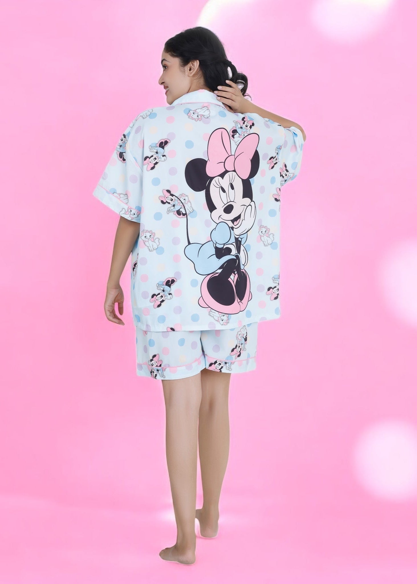 Woman wearing pastel blue cotton shorts set with Minnie Mouse and cat cartoon print, cute summer loungewear by WakeUp Chicq.
