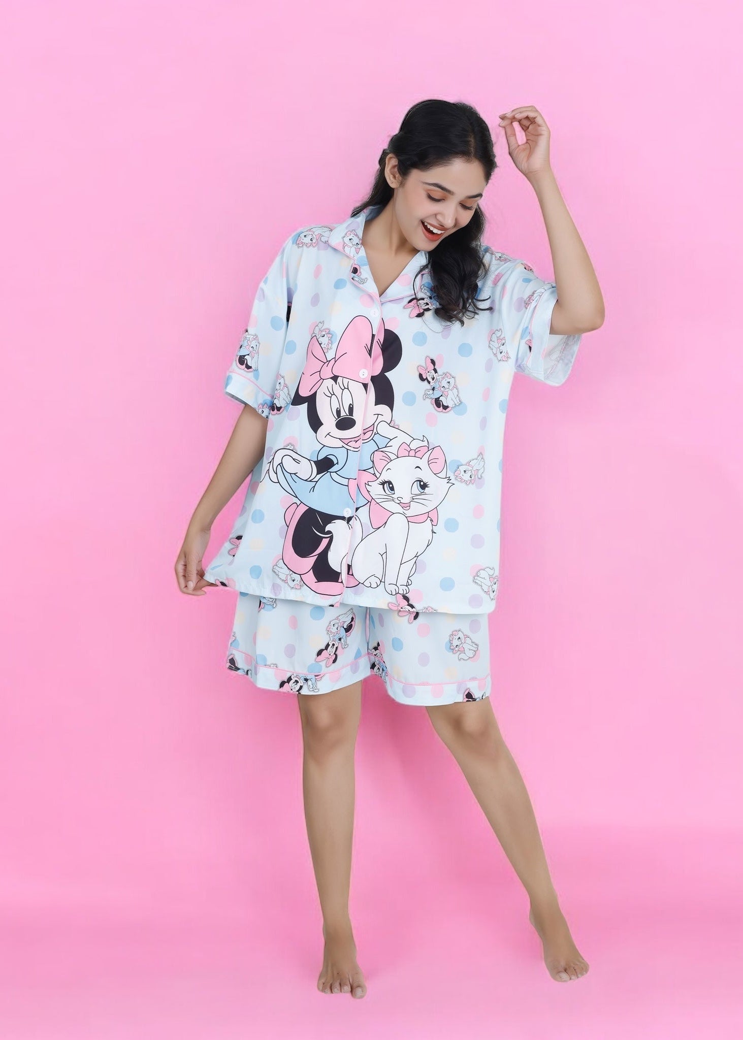 Woman wearing pastel blue cotton shorts set with Minnie Mouse and cat cartoon print, cute summer loungewear by WakeUp Chicq.