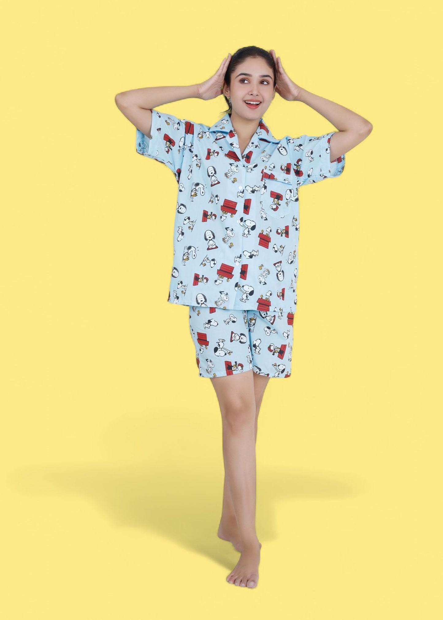 Woman in pastel blue cotton shorts set with Snoopy cartoon print, relaxed loungewear by WakeUp Chicq.