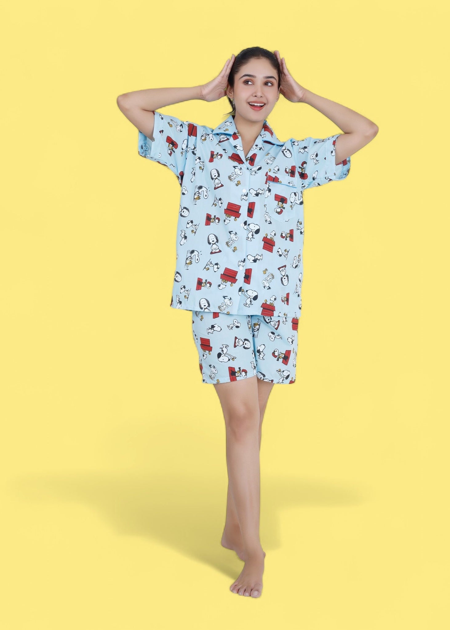 Woman in pastel blue cotton shorts set with Snoopy cartoon print, relaxed loungewear by WakeUp Chicq.