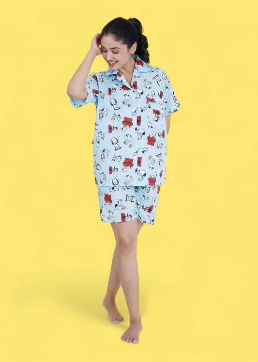 Woman in pastel blue cotton shorts set with Snoopy cartoon print, relaxed loungewear by WakeUp Chicq.
