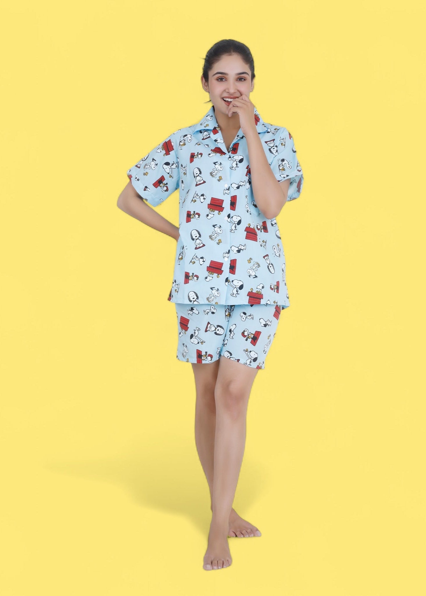 Woman in pastel blue cotton shorts set with Snoopy cartoon print, relaxed loungewear by WakeUp Chicq.