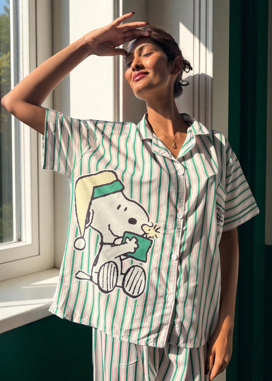 Model wearing WakeUp Chicq’s Big Snoopy Green & White Striped Pyjama Set — silky crepe nightwear with Snoopy print and green-white stripes.